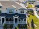 An aerial shot displays manicured landscaping surrounding beautiful townhomes with inviting front porches at 1194 Spotted Sandpiper Loop, Winter Springs, FL 32708