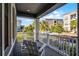 Relax on this charming front porch with white railing, offering a serene outdoor space at 1194 Spotted Sandpiper Loop, Winter Springs, FL 32708