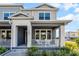 Inviting townhome with covered front porch and white railing, perfect for relaxing outdoors at 1194 Spotted Sandpiper Loop, Winter Springs, FL 32708