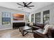 Spacious living room with a large window, ceiling fan and comfortable seating at 1194 Spotted Sandpiper Loop, Winter Springs, FL 32708