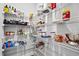 Organized walk-in pantry with wire shelving, providing ample storage for all your groceries at 1194 Spotted Sandpiper Loop, Winter Springs, FL 32708