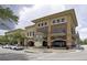 Attractive commercial building in a town center with brick accents, balconies, and a clock tower at 1194 Spotted Sandpiper Loop, Winter Springs, FL 32708
