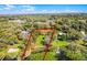 Aerial view of a lovely home and property including a dock and boathouse on the water's edge at 12002 Mckinnon Rd, Windermere, FL 34786