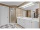 Well-lit bathroom with dual sinks, walk-in shower and lots of counterspace at 12002 Mckinnon Rd, Windermere, FL 34786