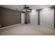 Bedroom featuring carpet flooring, large windows, and a ceiling fan at 12002 Mckinnon Rd, Windermere, FL 34786