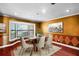 Dining room with a large window and space for Gathering gatherings and a modern table at 12002 Mckinnon Rd, Windermere, FL 34786