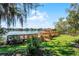 Scenic view of the lake from backyard, with dock and lake house at 12002 Mckinnon Rd, Windermere, FL 34786