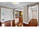 Inviting home foyer with hardwood floors and an open layout to the formal dining room at 12002 Mckinnon Rd, Windermere, FL 34786