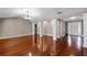 Spacious living area features pillars, hardwood floors, and an open design at 12002 Mckinnon Rd, Windermere, FL 34786