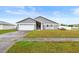 Charming single-story home with well-maintained lawn, driveway and garage at 12853 Maryland Woods Ct, Orlando, FL 32824