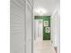 Hallway with closet doors, and a decorative wall offers a clean and inviting passage at 12853 Maryland Woods Ct, Orlando, FL 32824