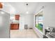 Bright kitchen with stainless steel appliances and a window view of the backyard offers a functional layout at 12853 Maryland Woods Ct, Orlando, FL 32824