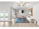 Bright living room features a ceiling fan, tiled floors and access to back yard at 12853 Maryland Woods Ct, Orlando, FL 32824