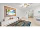 Comfortable living room featuring a large screen TV, minimalist decor, and tile flooring at 12853 Maryland Woods Ct, Orlando, FL 32824
