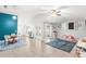 Open-concept living area with high ceilings, tile flooring, and natural light from sliding glass doors at 12853 Maryland Woods Ct, Orlando, FL 32824