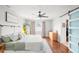 Inviting main bedroom featuring a ceiling fan, hardwood floors, neutral decor, and a closet at 12853 Maryland Woods Ct, Orlando, FL 32824