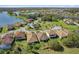 Beautiful aerial view of a community with manicured lawns and waterfront homes by a scenic lake at 1330 Bucktail Ct, Kissimmee, FL 34746