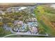 Aerial view of the community clubhouse, pools, and surrounding neighborhood at 1330 Bucktail Ct, Kissimmee, FL 34746