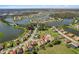 Stunning aerial view of a residential area featuring serene lakes and lush greenery at 1330 Bucktail Ct, Kissimmee, FL 34746