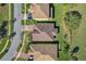 An aerial view of several homes, showcasing well-maintained roofs, driveways, and lush landscaping at 1330 Bucktail Ct, Kissimmee, FL 34746