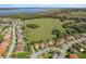 Beautiful aerial of homes with well-manicured lawns in a community bordering a conservation area and waterway at 1330 Bucktail Ct, Kissimmee, FL 34746