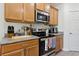 Well-equipped kitchen features stainless steel appliances, granite countertops, and ample cabinet space at 1330 Bucktail Ct, Kissimmee, FL 34746