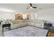 Bright, open-plan living room boasts a large sectional, eat-in kitchen, and modern finishes at 1330 Bucktail Ct, Kissimmee, FL 34746