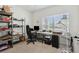 Bright office space with desk, shelving and window with views to the outdoors at 1330 Bucktail Ct, Kissimmee, FL 34746