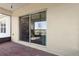 Covered brick patio with view into the interior through a large sliding glass door at 1330 Bucktail Ct, Kissimmee, FL 34746