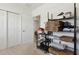 Storage room features two large doors and multiple shelves and containers for organization at 1330 Bucktail Ct, Kissimmee, FL 34746