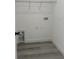 Laundry room with gray floors and shelving at 13566 Sw 43Rd Cir, Ocala, FL 34473