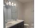 Bathroom with double vanity, modern fixtures, and good lighting at 137 Willow Dr, Kissimmee, FL 34759