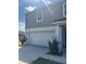 Attached two-car garage, providing convenient and secure parking at 137 Willow Dr, Kissimmee, FL 34759