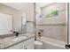 Bathroom with large vanity, tile shower and a separate bathtub at 1385 5Th St, Orange City, FL 32763