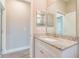 Bright bathroom featuring granite countertop and vanity with modern finishes and luxury fixtures at 1385 5Th St, Orange City, FL 32763