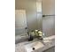 Granite countertop bathroom vanity with fresh flowers and neutral towels for a relaxing feel at 1385 5Th St, Orange City, FL 32763