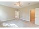 Spacious bedroom featuring neutral walls, plush carpet, and a modern ceiling fan at 1385 5Th St, Orange City, FL 32763
