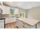 Stylish kitchen featuring stainless steel appliances, granite countertops, and a functional center island at 1385 5Th St, Orange City, FL 32763