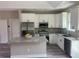 Modern kitchen with stainless steel appliances, granite countertops, and a stylish center island at 1385 5Th St, Orange City, FL 32763