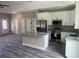 Modern kitchen with stainless steel appliances, granite countertops, and a stylish center island at 1385 5Th St, Orange City, FL 32763