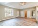 Spacious living room with abundant natural light, showcasing the light wood floors and neutral wall colors at 1385 5Th St, Orange City, FL 32763