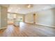 Bright, open-concept living space featuring durable wood-look flooring and modern recessed lighting at 1385 5Th St, Orange City, FL 32763