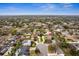 Aerial view of a home in a neighborhood featuring mature trees and swimming pools at 1581 Monica Joy Cir, Longwood, FL 32779