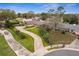 Aerial view of a well-maintained home with a long driveway and lush landscaping at 1581 Monica Joy Cir, Longwood, FL 32779