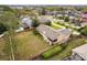 Aerial view of a cozy home featuring a backyard with mature trees, and a wood fence at 1581 Monica Joy Cir, Longwood, FL 32779