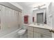 Well-lit bathroom features a shower-tub combination and a vanity with ample storage space at 1581 Monica Joy Cir, Longwood, FL 32779