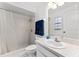 This well-lit bathroom features tile floors and shower, with an expansive mirror above a generous vanity at 1581 Monica Joy Cir, Longwood, FL 32779