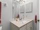 Well-lit bathroom with a clean aesthetic, featuring a mirror and vanity with neutral countertops at 1581 Monica Joy Cir, Longwood, FL 32779