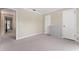Neutral bedroom featuring two closets and light beige carpet at 1581 Monica Joy Cir, Longwood, FL 32779