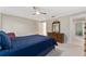 Bedroom with bed, dresser, and chair, bathed in natural light at 1581 Monica Joy Cir, Longwood, FL 32779
